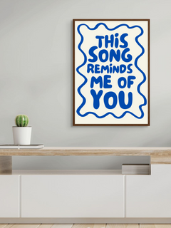 Aesthetic wall art print featuring the phrase 'This song reminds me of you' on a stylish backdrop.